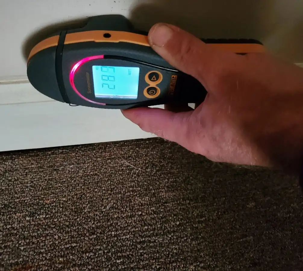 Moisture detection at baseboard during Storm Damage Restoration in Rutland